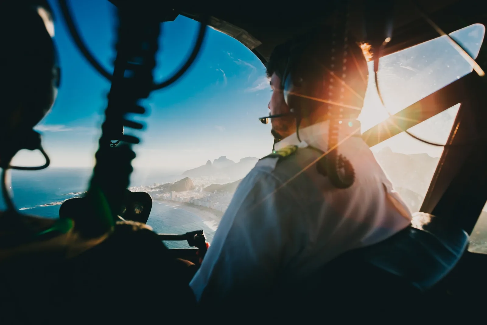 Pilot in a sunlit aircraft cockpit